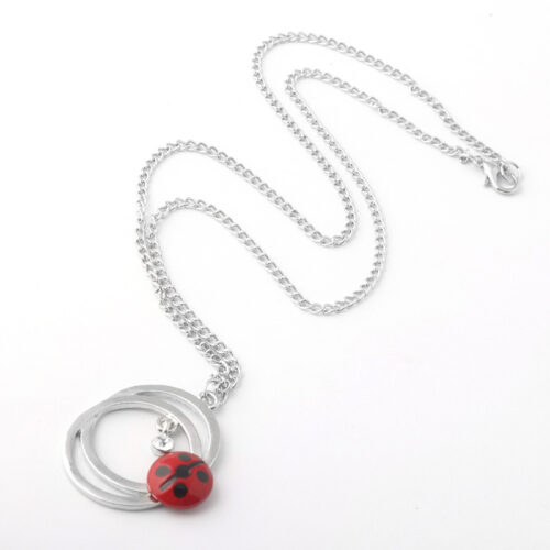 COLLIER EN FORME DE CHAT ET COCCINELLE